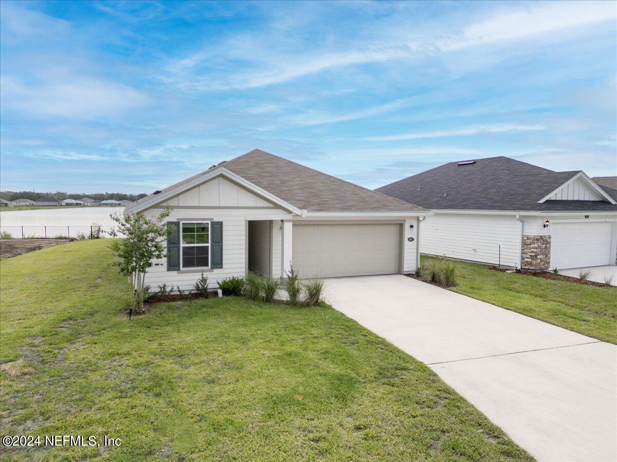 a view of a yard in front of a house with a yard