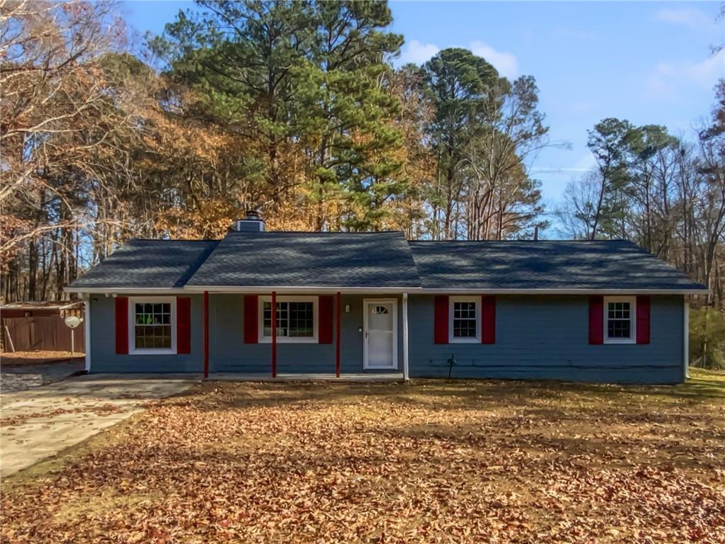 a house that has a tree in front of it