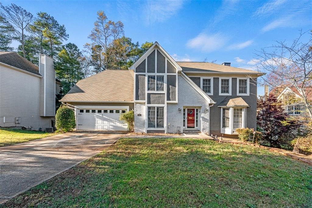 a front view of a house with a yard