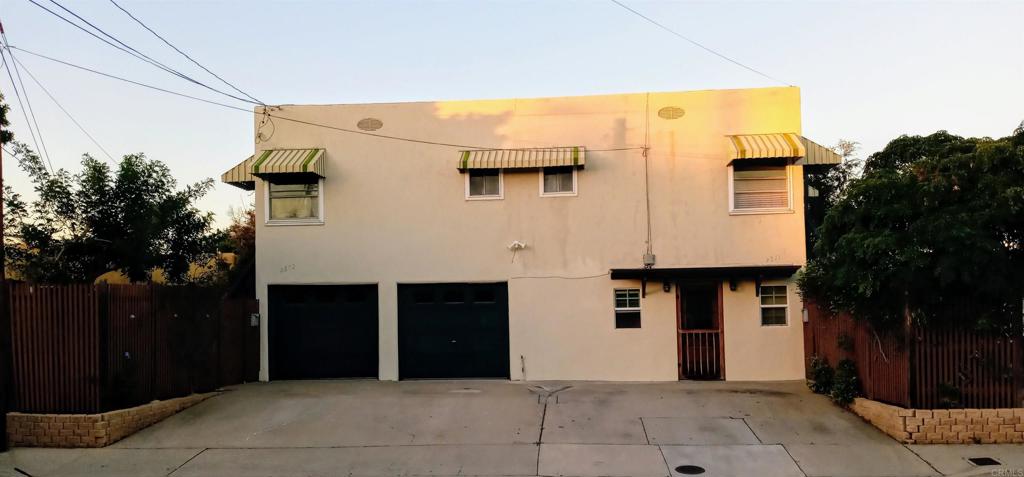 a front view of a house with garage