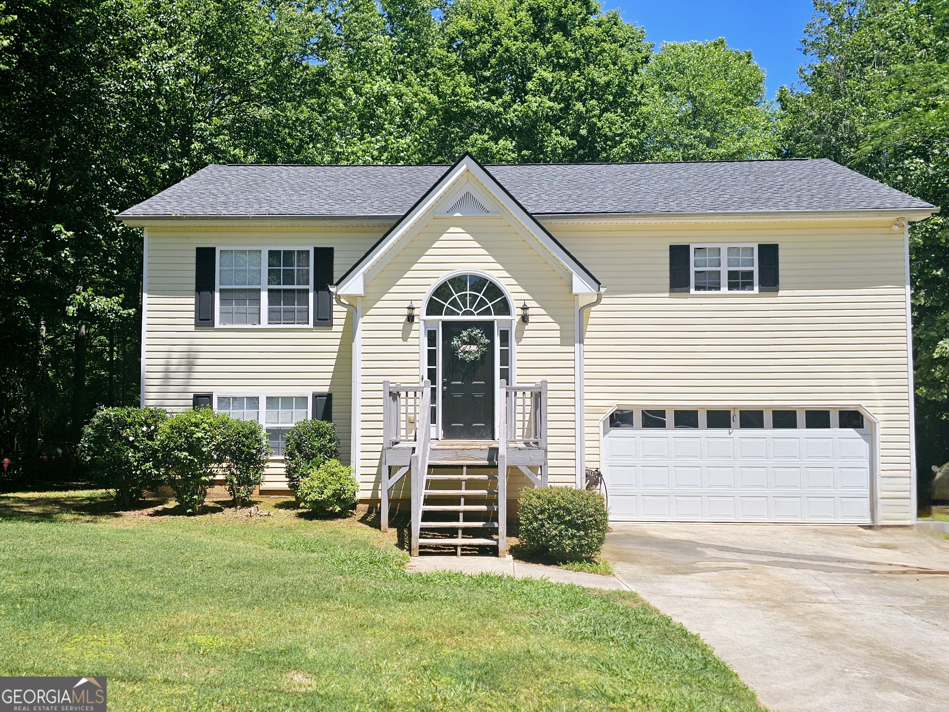 a front view of a house with a yard