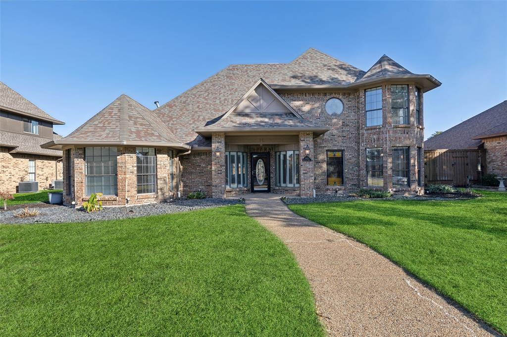 a view of a house with a yard porch and furniture