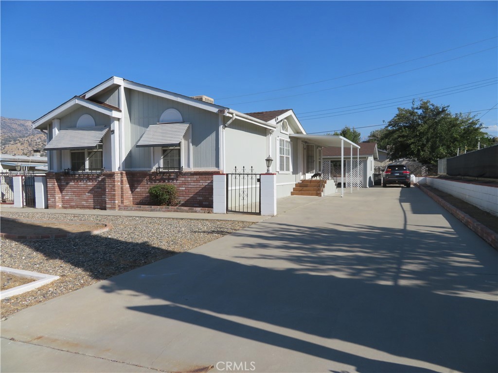 a view of a house with a street