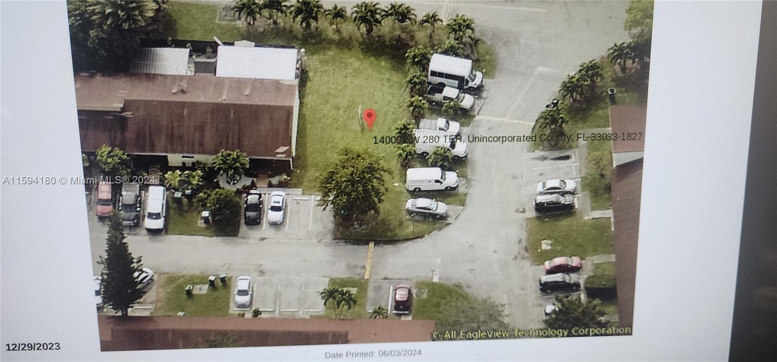 an aerial view of a house with outdoor space