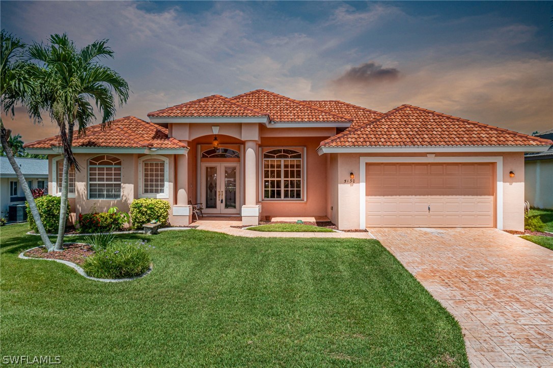 front view of a house with a garden