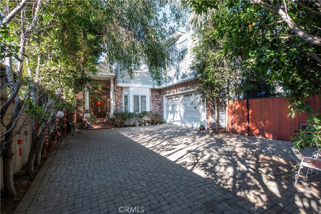 a view of a house with a tree