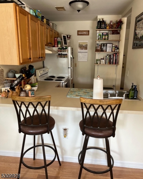 a view of a dining room with furniture and window