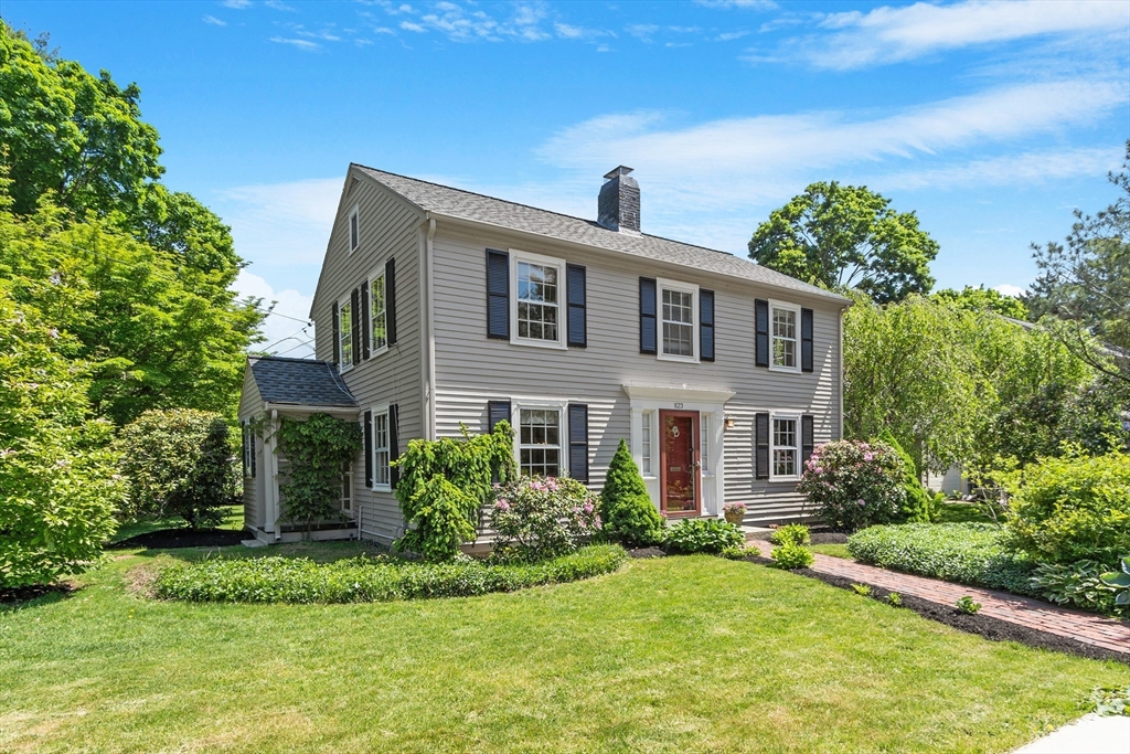 a front view of a house with a yard