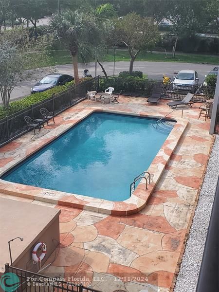 a view of swimming pool from a yard