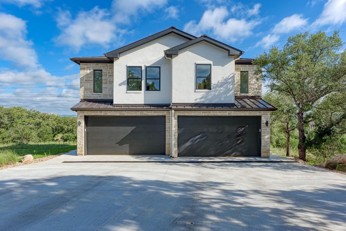 a front view of a house with a garage