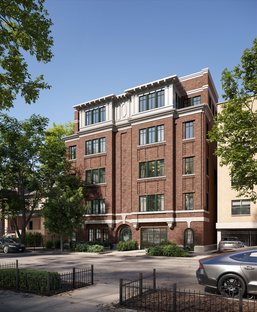 a front view of a residential apartment building with a yard