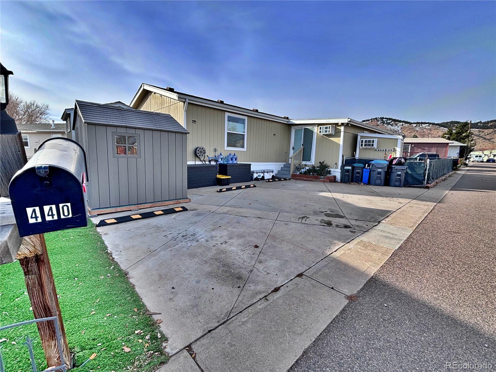 a view of a car park in front of a house