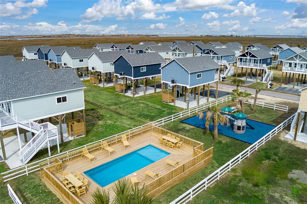 an aerial view of a house with a ocean view