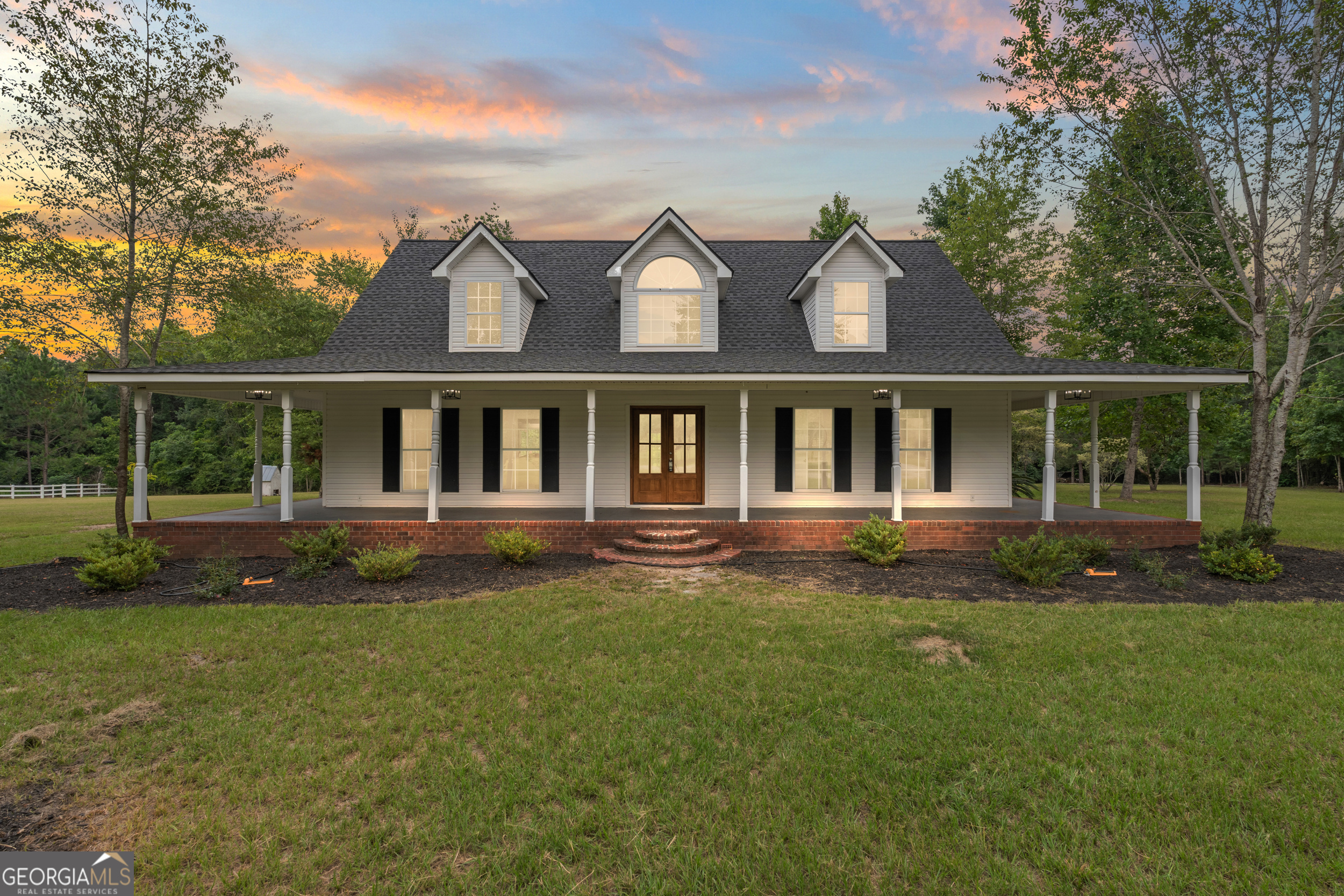 front view of a house with a yard