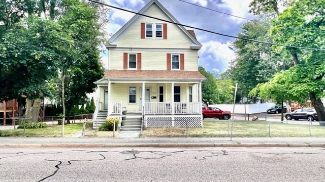 front view of a house with a yard