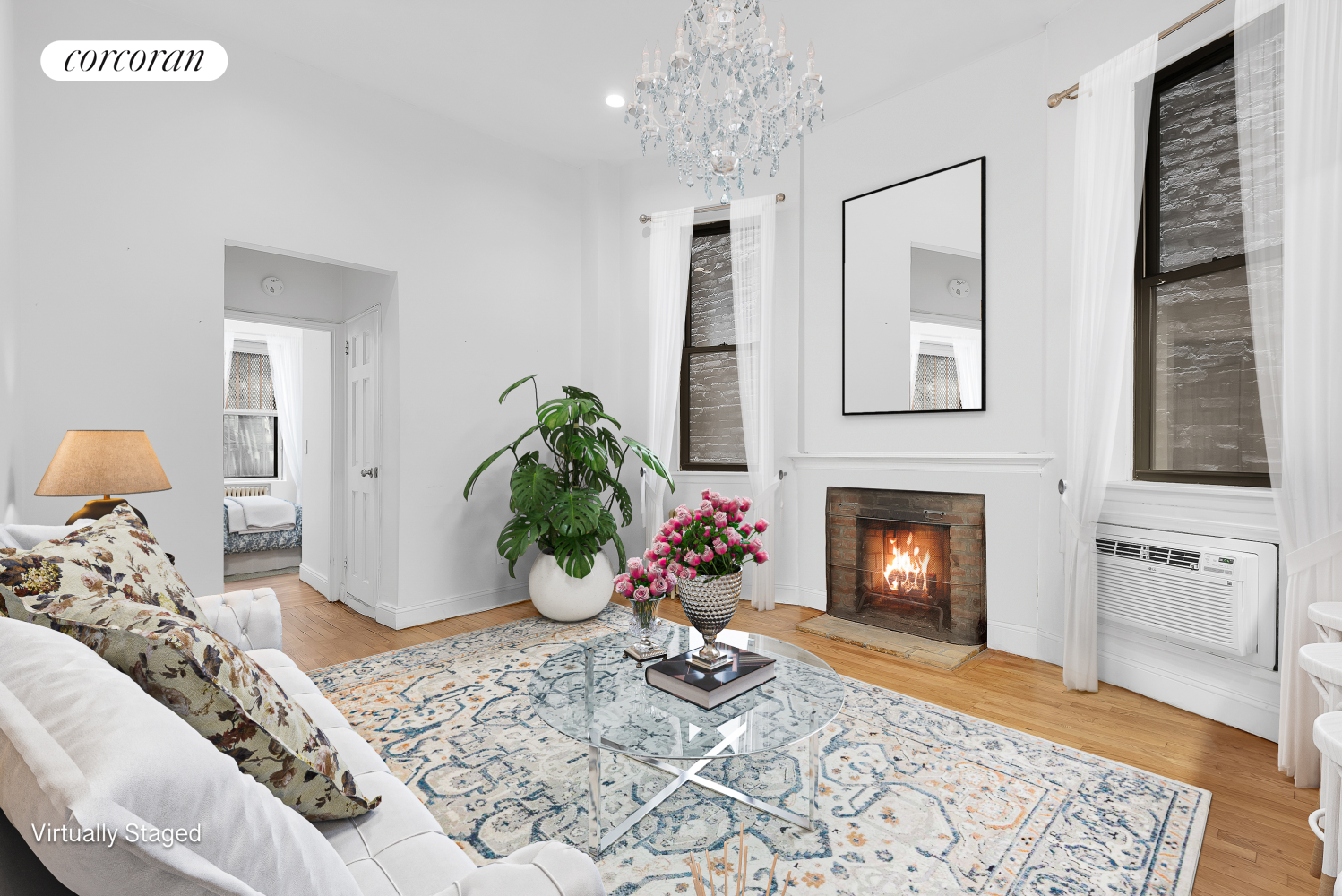 a living room with furniture and a fireplace