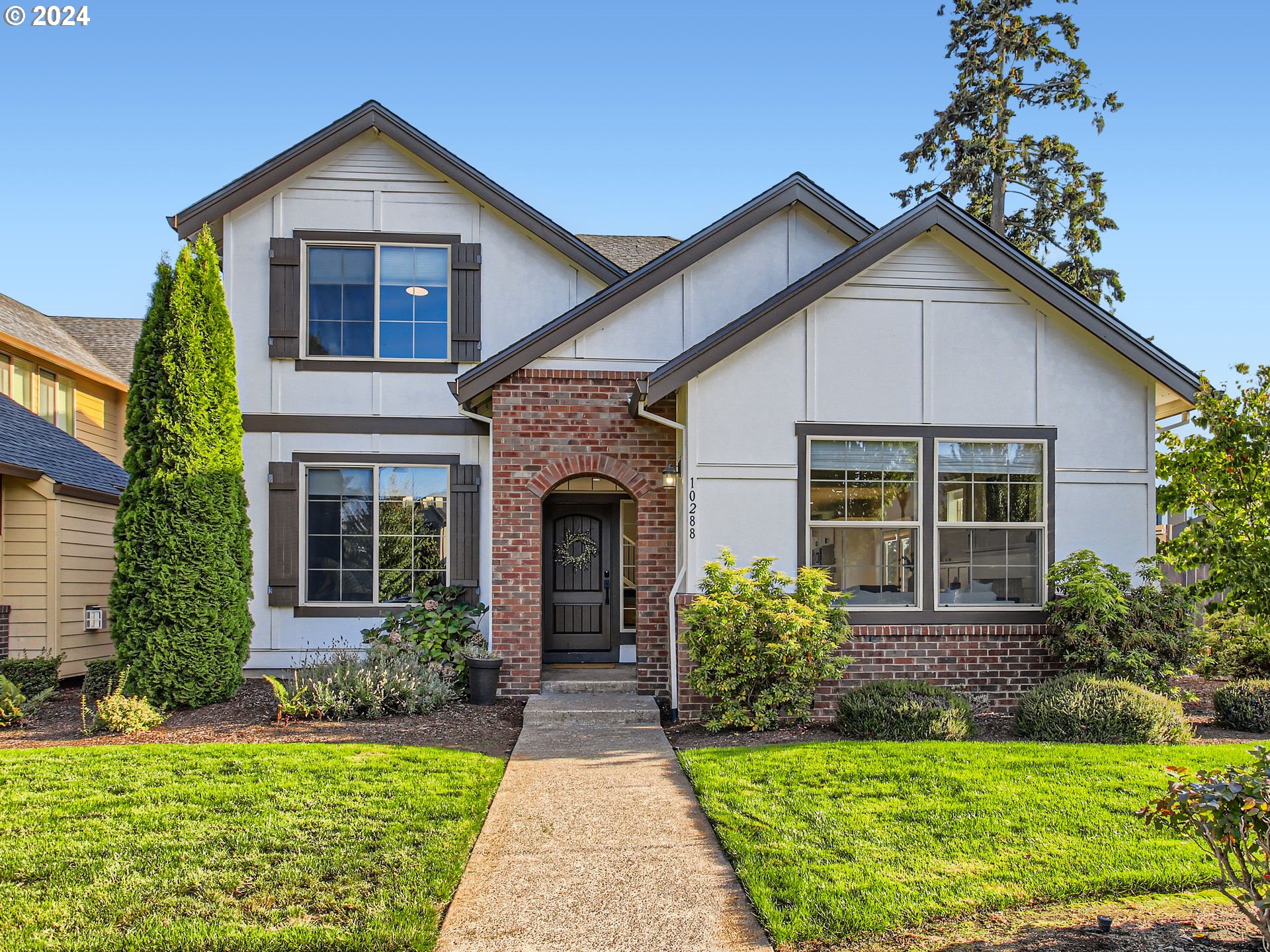 a front view of a house with a yard