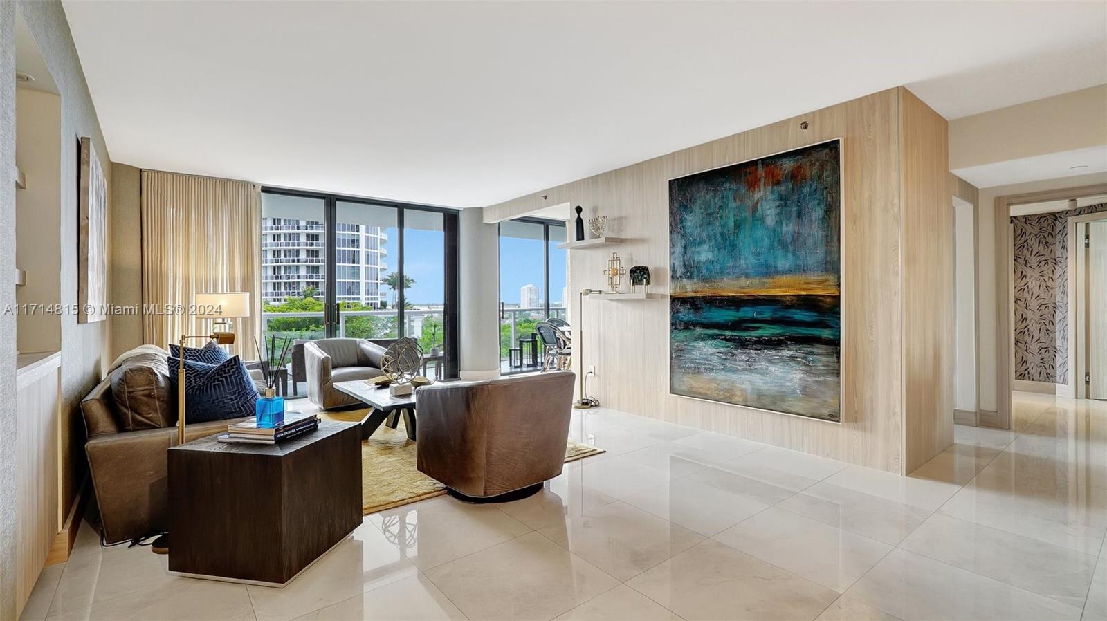 a living room with furniture and large windows