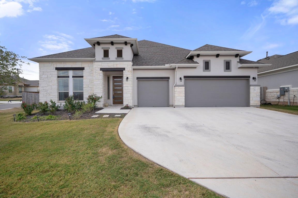 a front view of a house with a yard