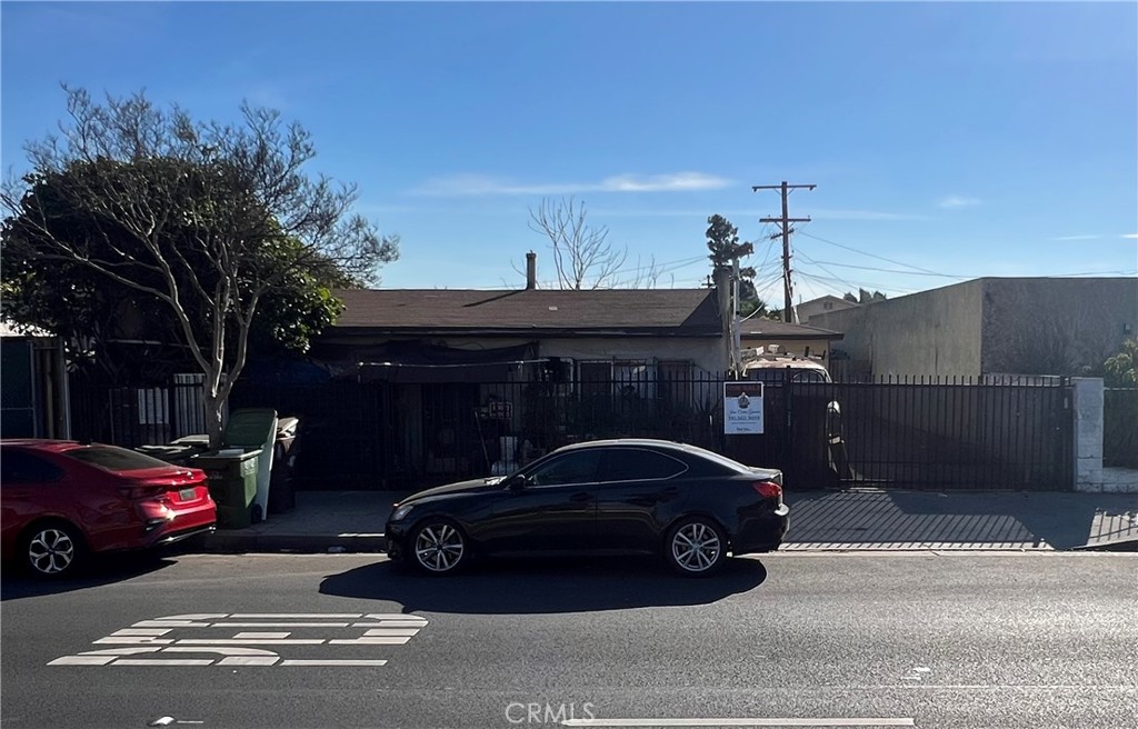 a view of a car parked in front of a house