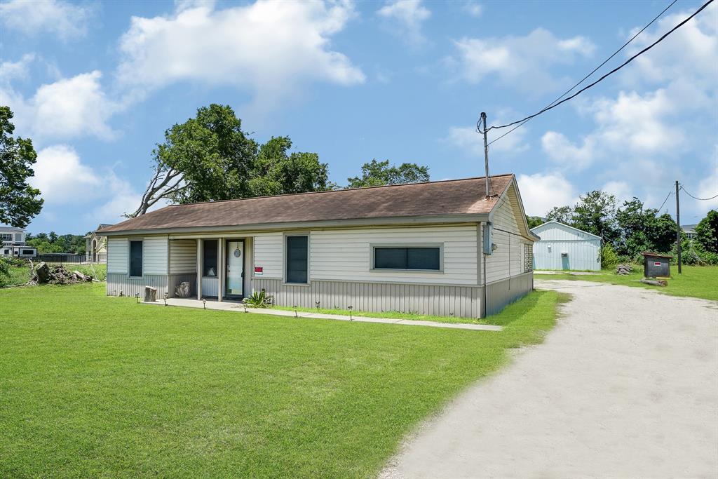 a house view with a sitting space and garden