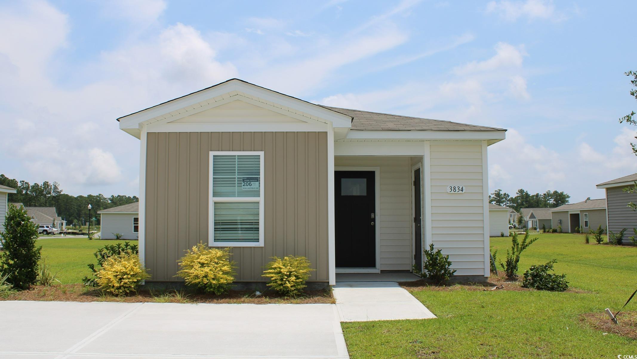 View of front of house with a front lawn