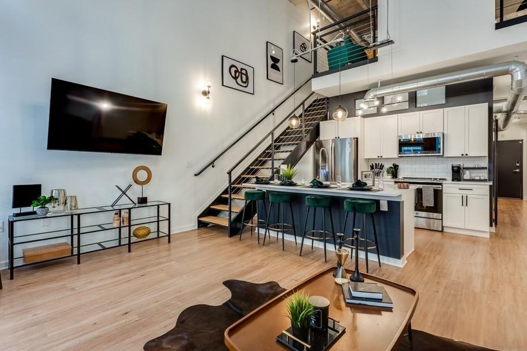 a living room with furniture and a flat screen tv