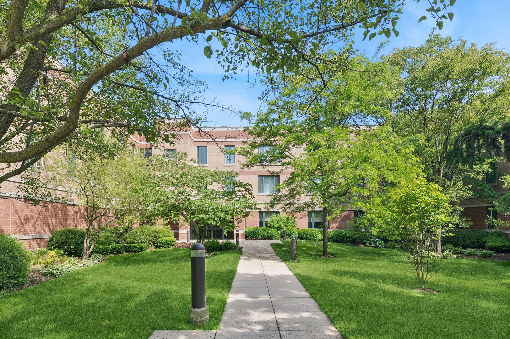 a view of a pathway with a big yard