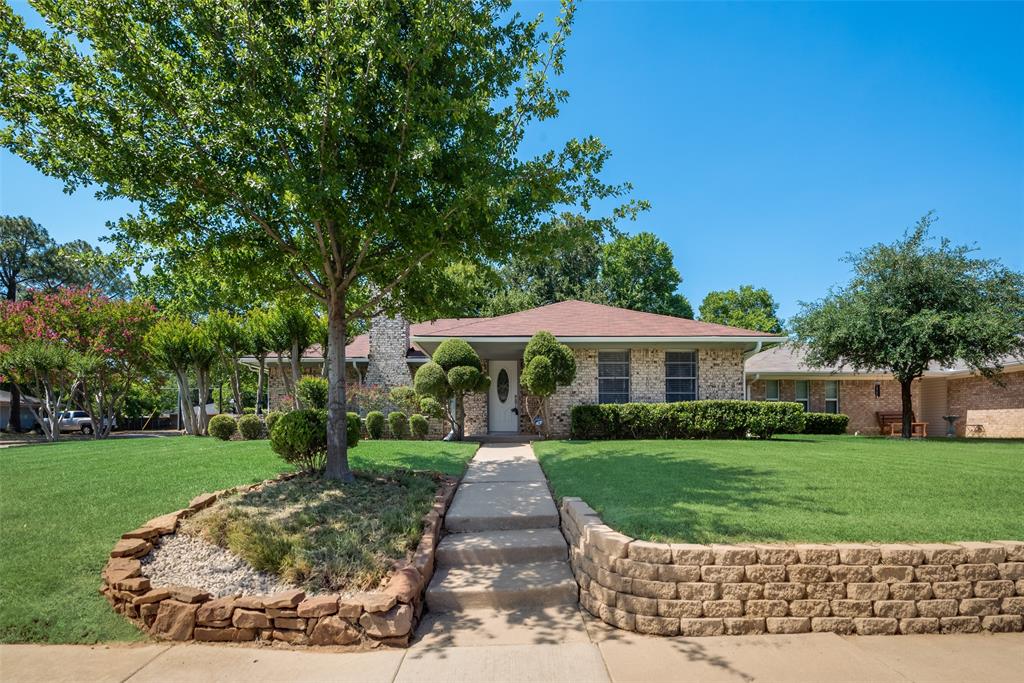 a view of a patio with a yard