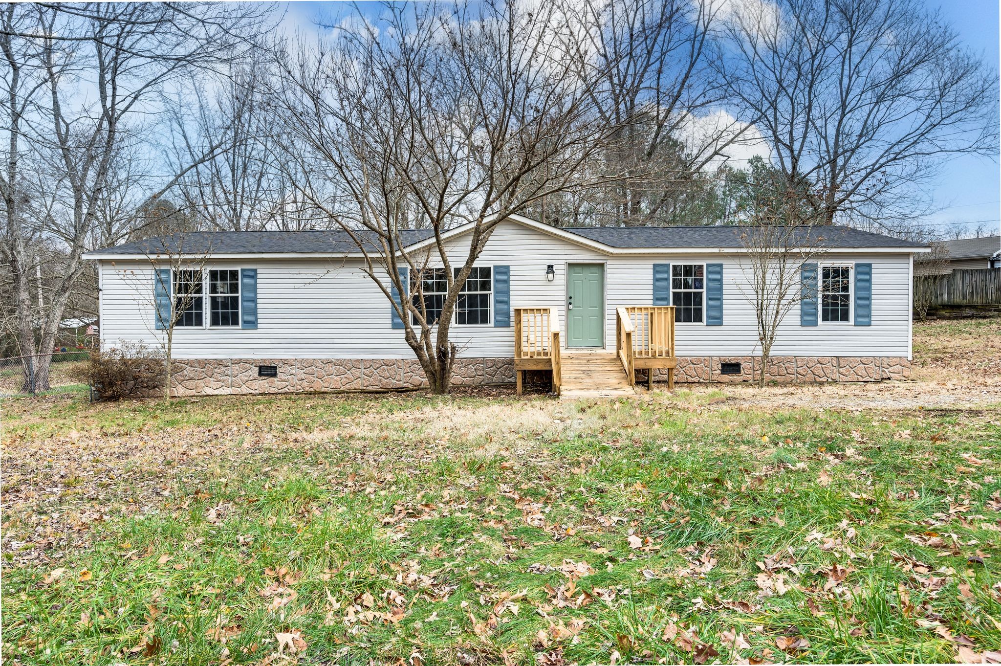 front view of a house with a yard