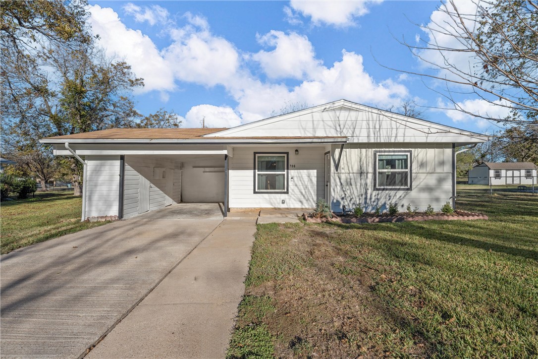 front view of a house with a patio