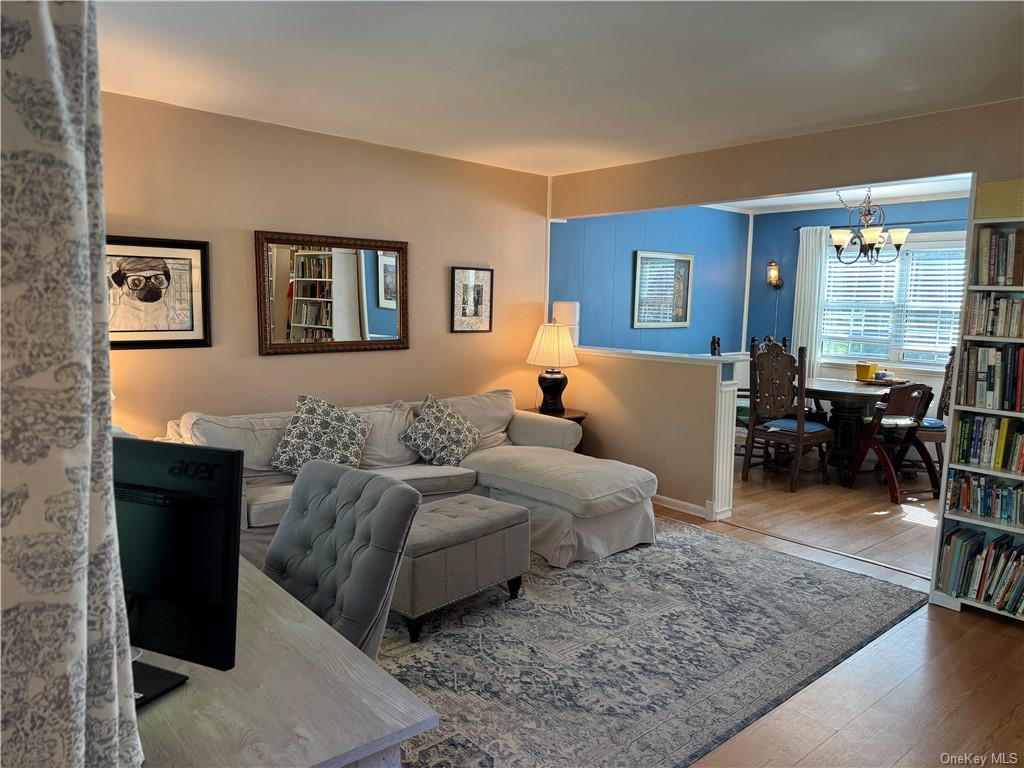 a living room with furniture rug and window