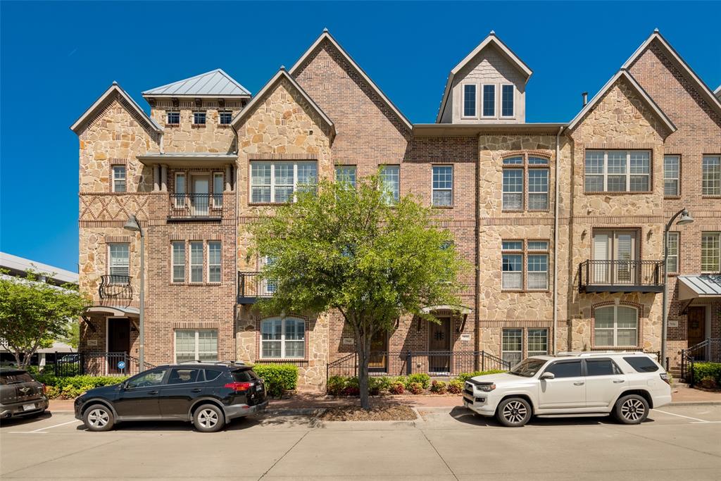 a car parked in front of a brick house