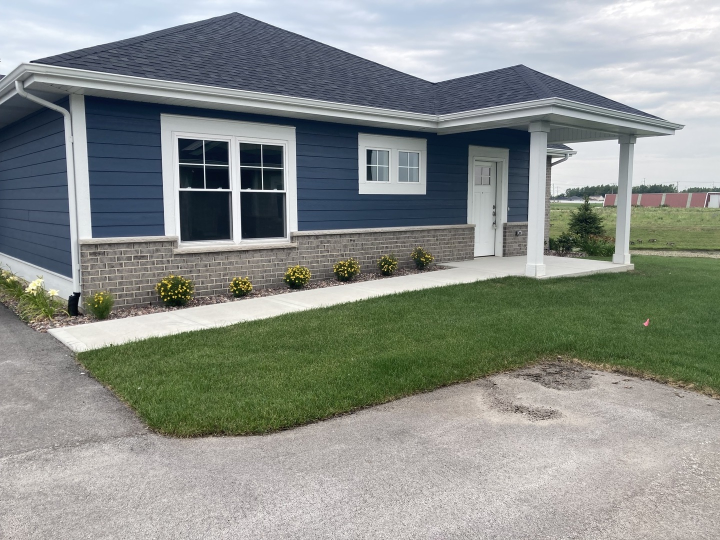 a front view of a house with a yard