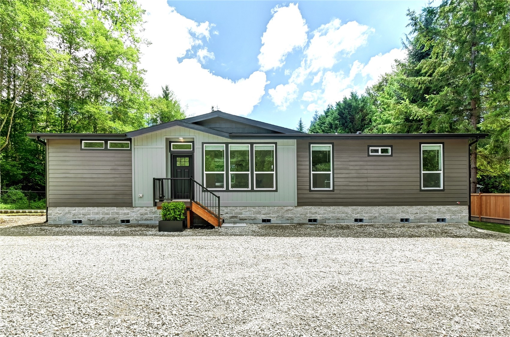 a view of a house with backyard sitting area and garden