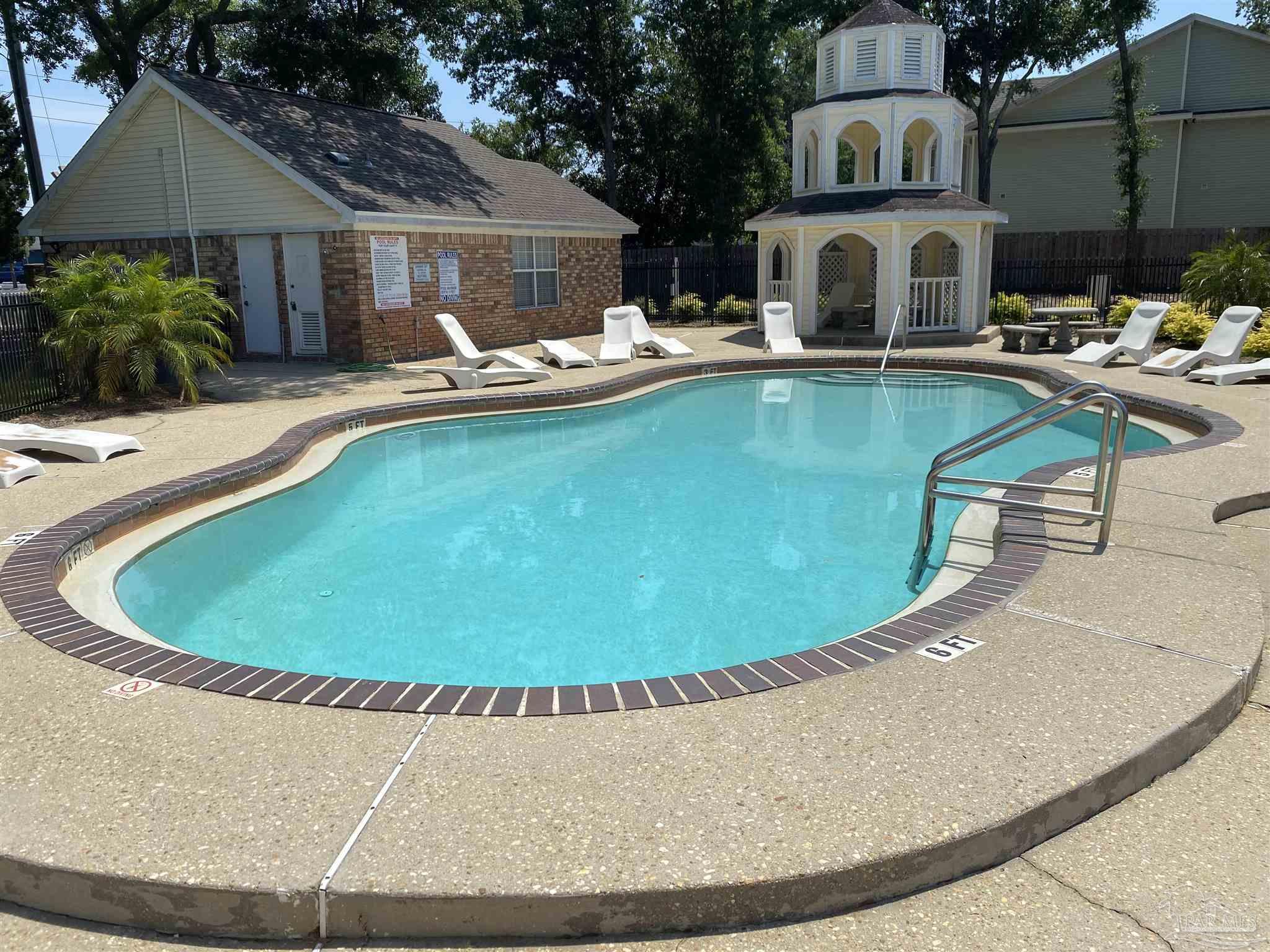 a view of a house with swimming pool