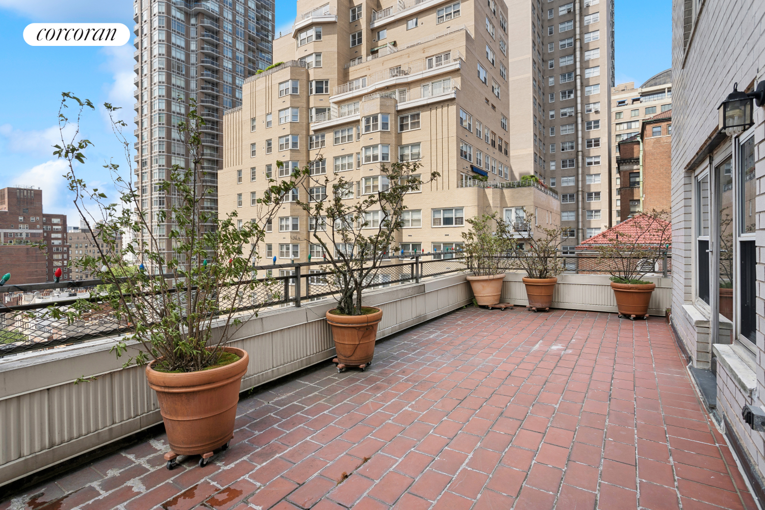 a view of a patio with table and chairs