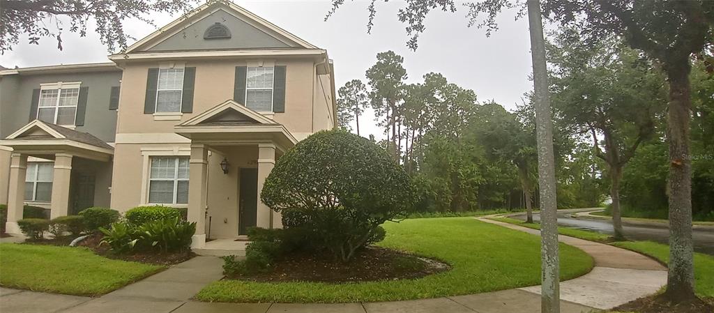 a front view of a house with garden