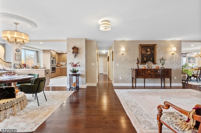 a living room with furniture and a dining table