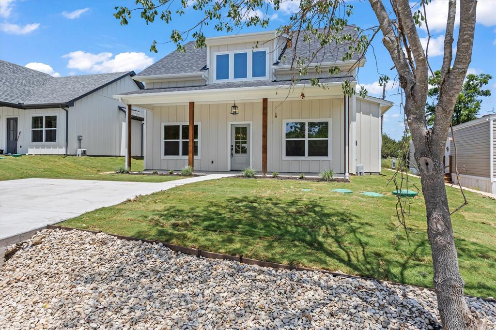 front view of a house with a yard