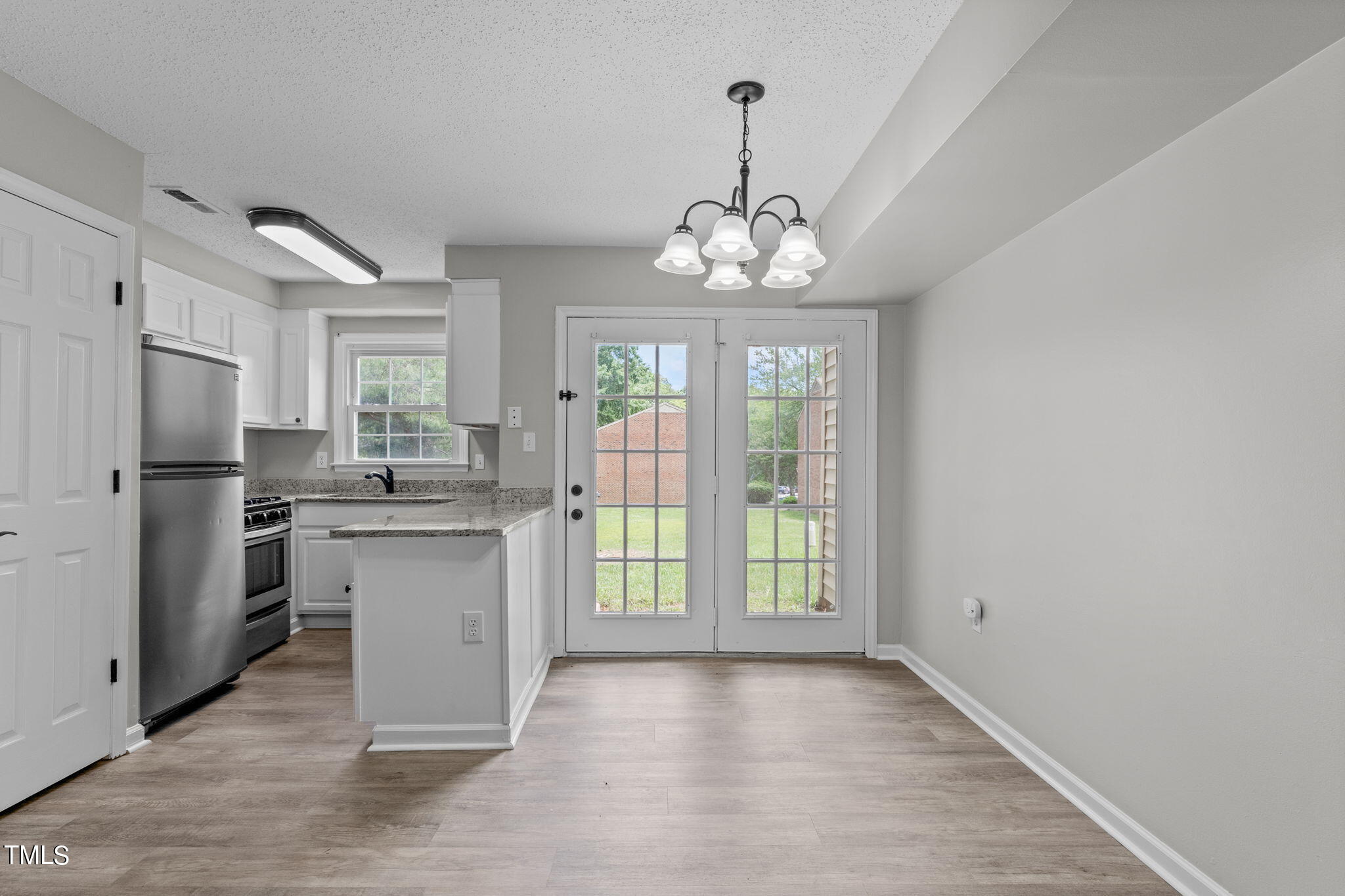 a view of a kitchen with a sink and dishwasher kitchen view