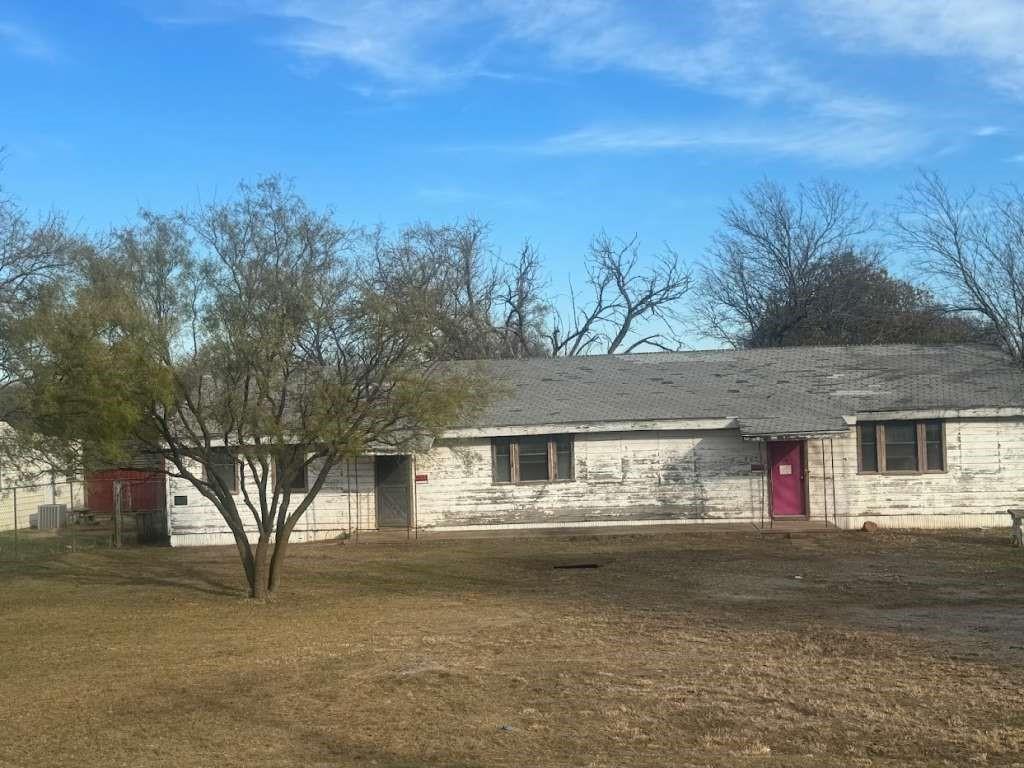 a view of house with outdoor space and trees