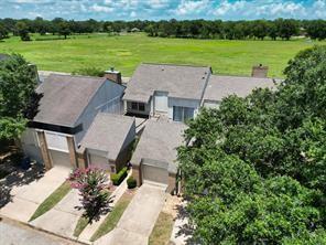 an aerial view of a house with big yard