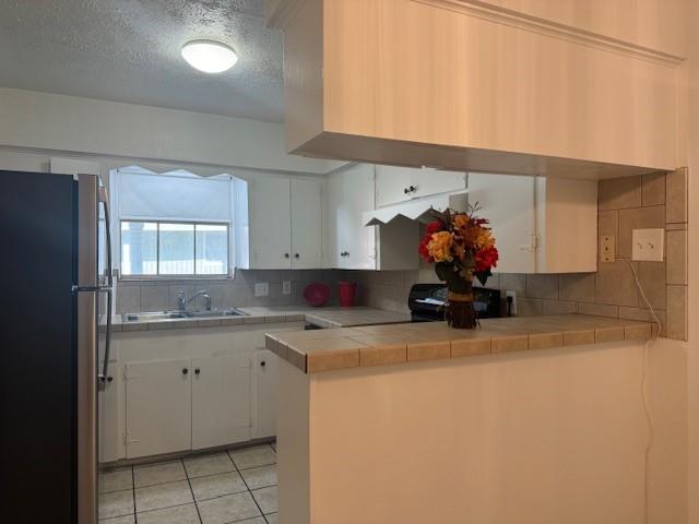 a kitchen with a sink a cabinets and window