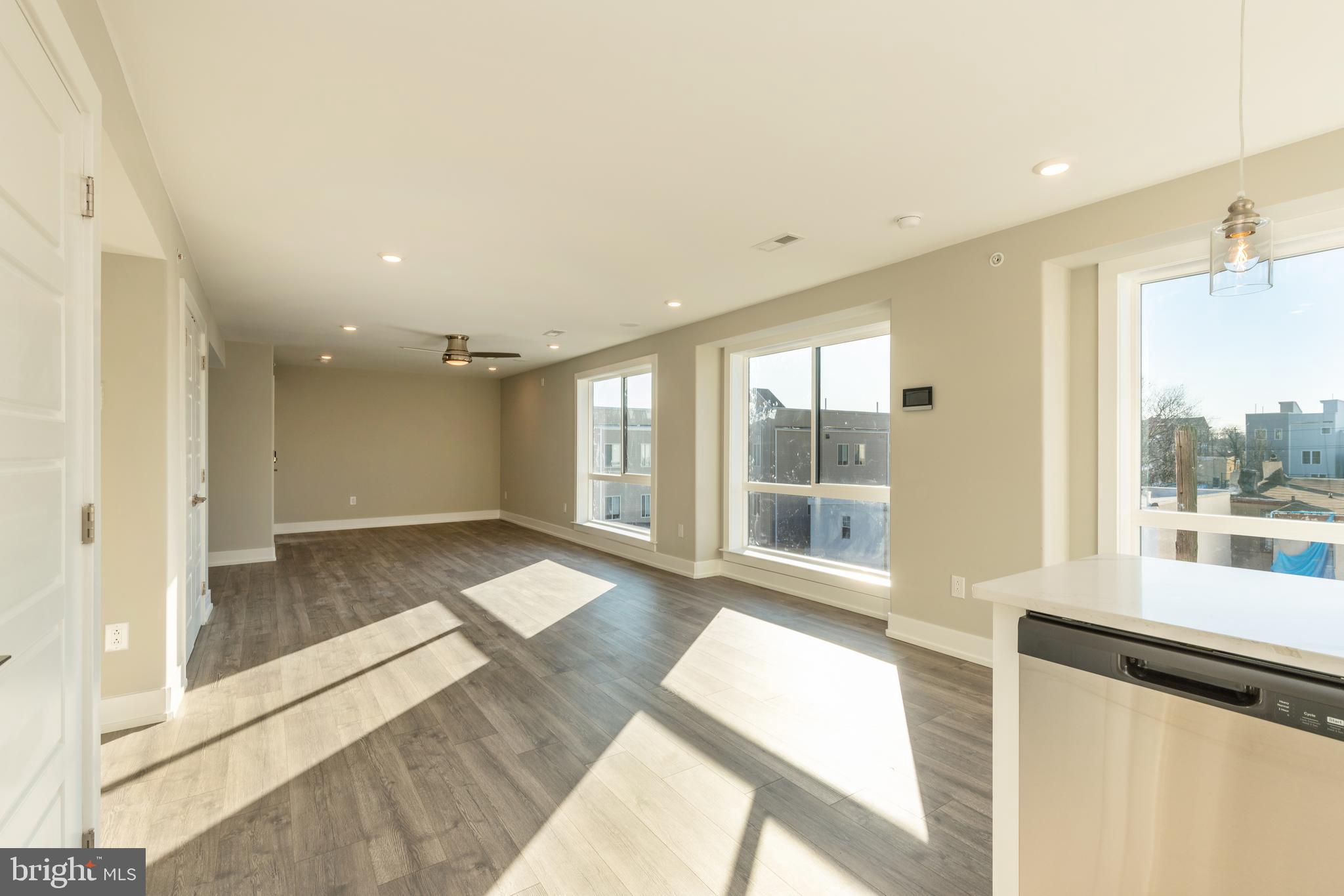 a view of an empty room and a window