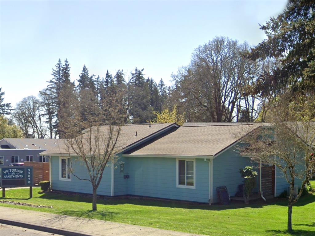 a front view of a house with garden