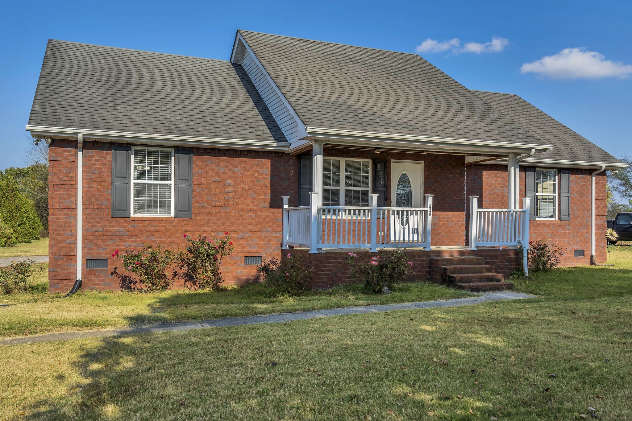 a front view of a house with garden