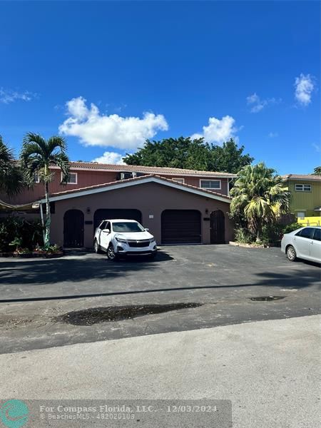 a view of a car parked in front of a house