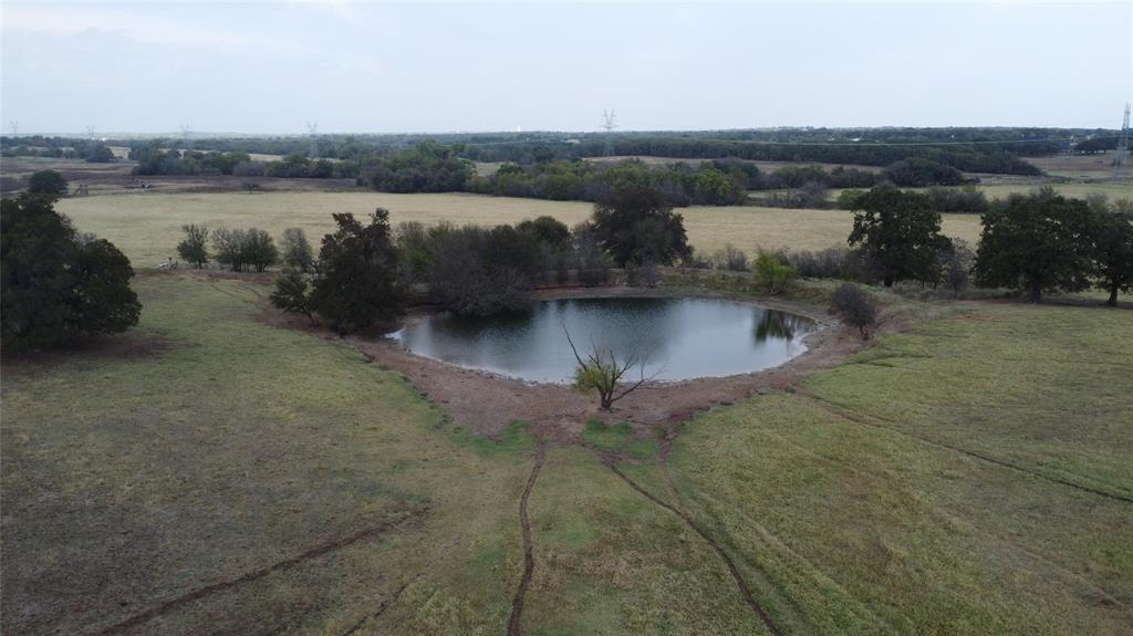 a view of a water pond with green space