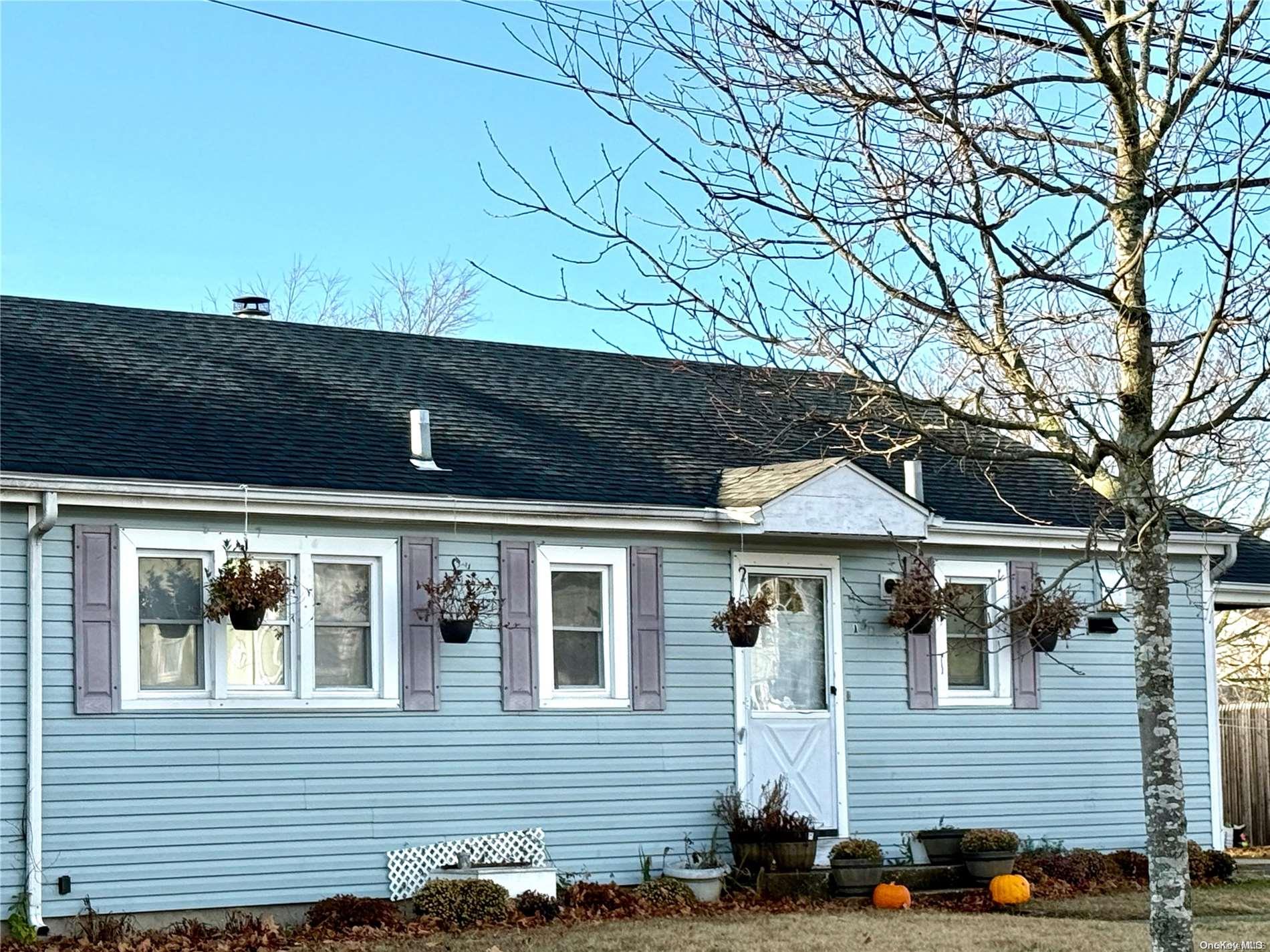 a view of house with a tree